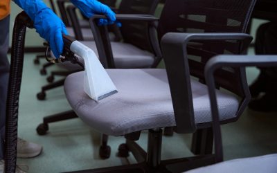 Certified cleaning specialist using upholstery vacuum-cleaner for chairs Certified cleaning specialist using upholstery vacuum-cleaner for chairs